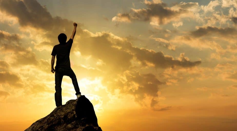 Man on the peak of mountain and sunlight , success,winner, leade