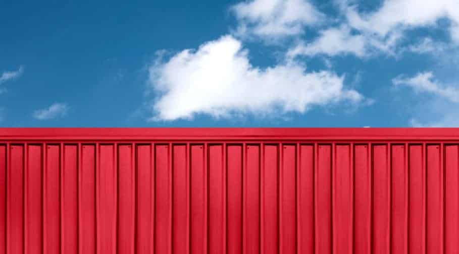 texture of red cargo ship container located with blue sky backgr