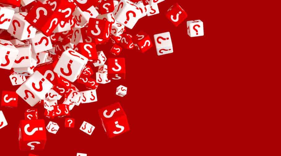 Lots of falling red and white dice with question marks on the si